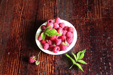 Ripe raspberries in a bowl.