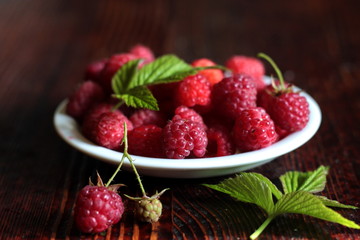Ripe raspberries in a bowl.
