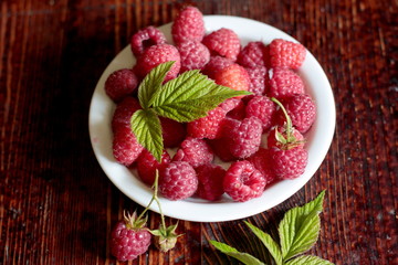 Ripe raspberries in a bowl.