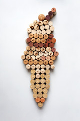 Wine corks ice cream cone abstract composition isolated on white background from a high angle view