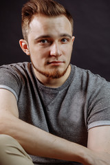 close up portrait of attractive red-haired male teenager. cropped photo