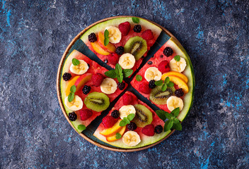 Watermelon pizza with fruit and berries