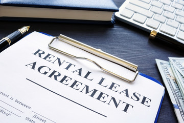 Rental lease agreement with pen on a desk.