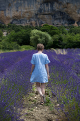 Joyful and happy woman in a beautiful lavander field