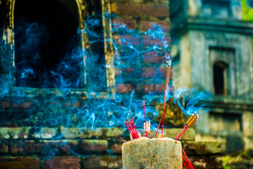 Incense sticks in the Buddhist Bich Dong pagoda complex, Tam Coc, Ninh Binh in Vietnam