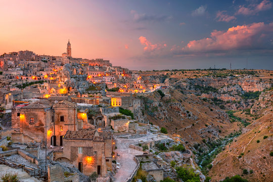 Fototapeta Matera, Italy. Cityscape aerial image of medieval city of Matera, Italy during beautiful sunset.
