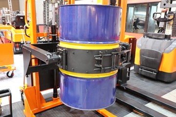 Drum lifted by drum stacker
