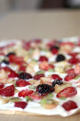 Frozen yogurt bark with various fruit strawberry, banana, nectarine, kiwi, raspberry, blackberry and stevia. Healthy, sugar free and gluten free snack. Selective focus. 
