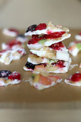 Frozen yogurt bark with various fruit strawberry, banana, nectarine, kiwi, raspberry, blackberry and stevia. Healthy, sugar free and gluten free snack. Selective focus. 
