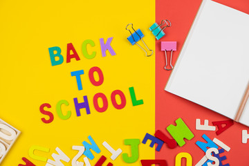 Top view of back to school wording on colorful background