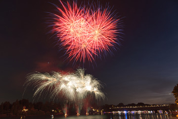 Fireworks on the river in summer evening