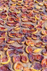 Homemade dried apricots. A leaf with halves of apricots