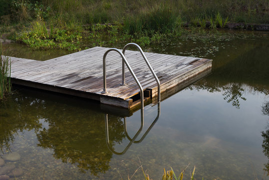 Natural swimming pool pond stairs wooden platform pier NSP garden water biotope nobody