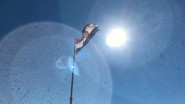 Slow motion shot of Croatian flag in the wind and sun, Split, Dalmatia, Croatia