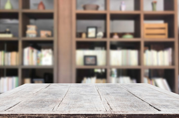 Wooden board empty table space platform in front of blurred library Of The background - can be used for display or montage your products. Mock up for display of product.