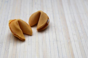 Fortune cookies isolated on a bamboo background