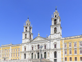 Fototapeta na wymiar National palace of Mafra. Neighborhood of Lisbon, Portugal. Franciscan monastery. Baroque architecture style. Concept of travel and tourism.