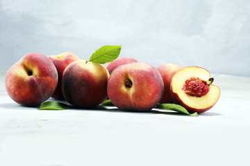 A group of ripe peaches on table
