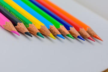 Pencils lined up in shallow focus.