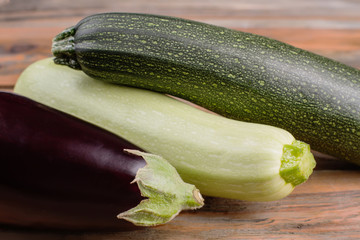 Organic vegetables close up. Eggplant, zucchini and courgette. Macro photography.