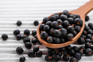 dried juniper berries on a white background