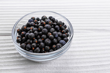 dried juniper berries on a white background