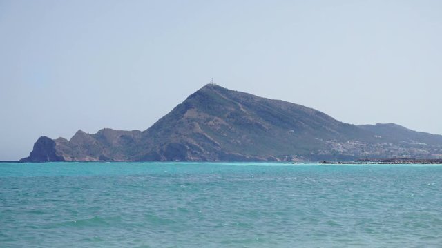 Punta Bombarda Cape and mediterranean sea from the town of Altea, Costa Blanca, Spain. Wave crushing coast.