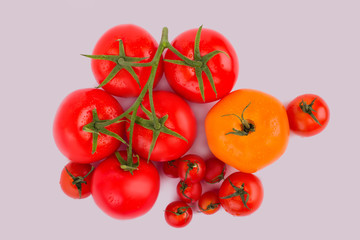 Washed clean tomatoes and cherry tomatoes. White isolated background, cut out.