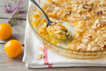 Yellow plume crumble on wooden table