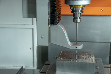 The vertical CNC gun-drill machine drilling the mold part .The Hi-Technology manufacturing process.