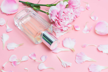 Obraz na płótnie Canvas Perfume bottles on pink background