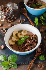 Chocolate pudding, banana and herbs in