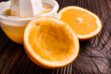 oranges and juice on a wooden background