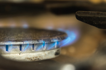macro gas burner with a blue flame