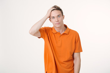 Portrait of a man with shocked facial expression, white background