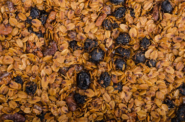 Granola baked in oven with nuts