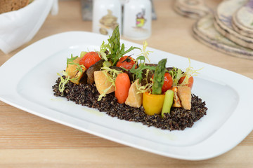 Baked vegetables: potato, zucchini, eggplant on plate. Vegetarian food