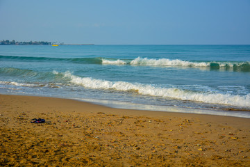 Waves run to the sea sandy beach in the early morning