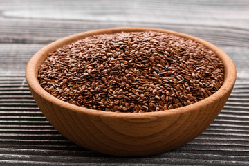 flaxseed and oil on a rustic background