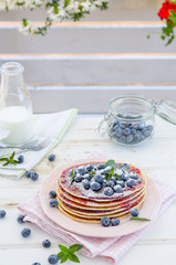 Vintage pancakes outside garden with blueberries