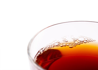 Fresh black tea in a transparent mug