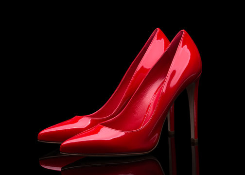 Red high heeled shoes and black background