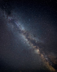 Beautiful vibrant image of Milky Way galaxy over sea landscape in Dorset England