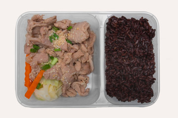 Rice berry and stir fried pork with sesame served with carrot and cabbage, Clean food concept