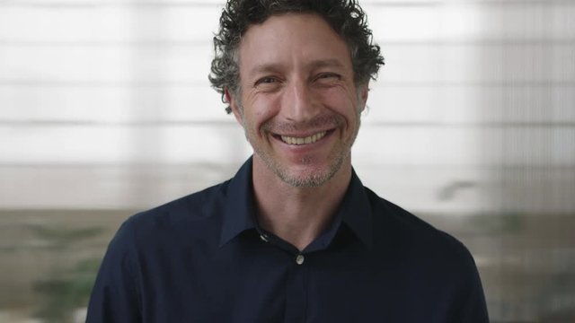 close up portrait of handsome mature entrepreneur man smiling enjoying successful business career opportunity