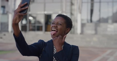portrait happy african american business woman using smartphone taking selfie photo making faces funny professional black female enjoying mobile technology