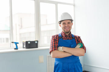 Portrait of handsome caucasian man in builders helmet.