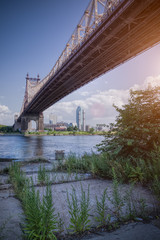 Fototapeta premium 57th street bridge in NYC with cloudy blue sky