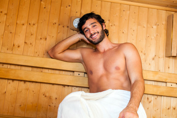 Man relaxing in a sauna