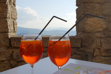 A relaxing italian spritz in an ancient castle with a wonderful landscape
